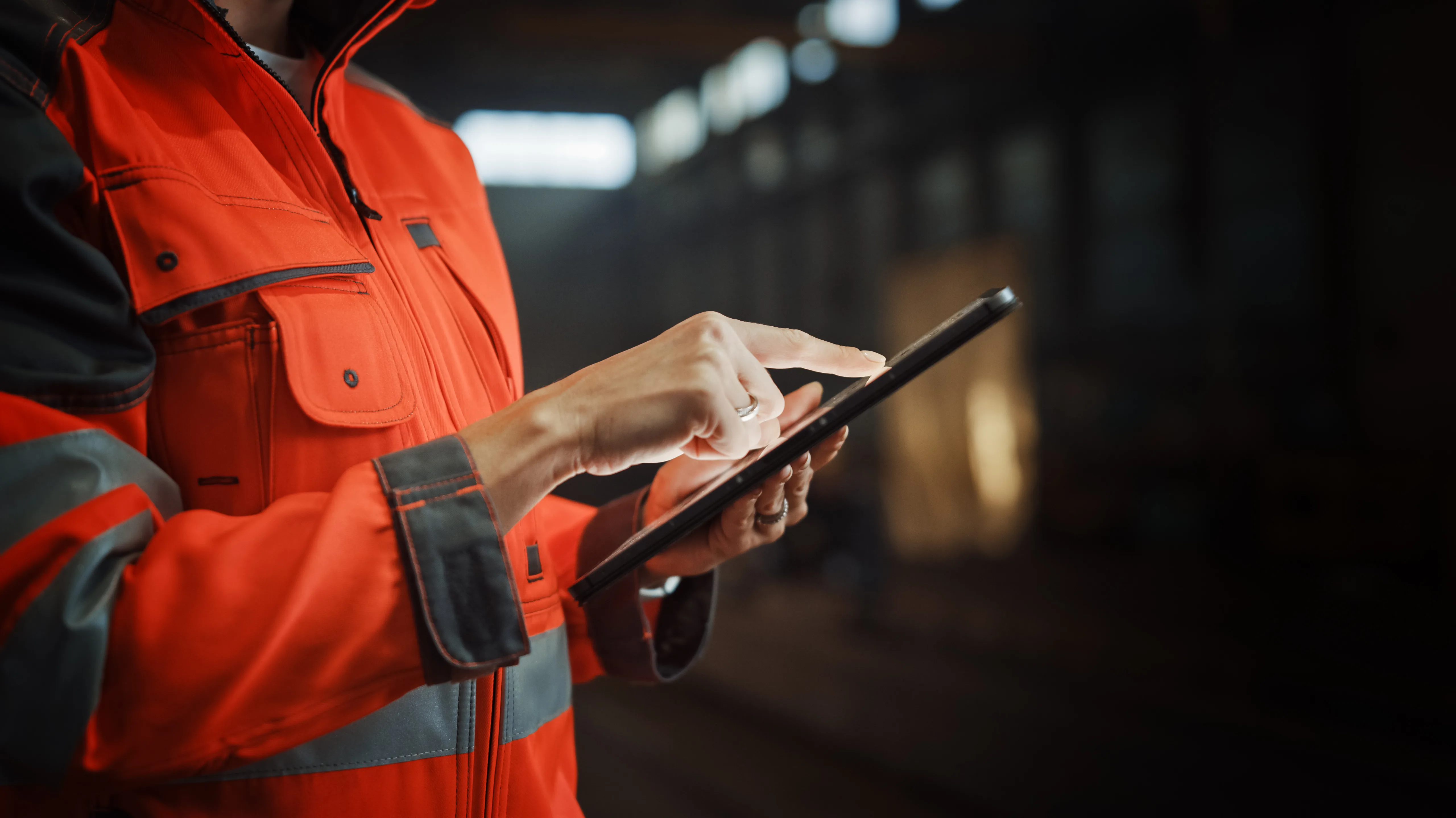 Fire safety professional using tablet for digital fire risk assessment and compliance documentation
